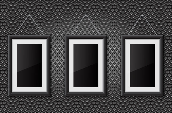 Three black empty pictures on metal perforated background
