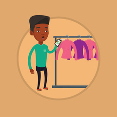 Man shocked by price tag in clothing store.