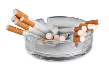 Glass ashtray and cigarette on white background