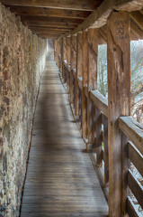 

Castle wall passage .Antique wooden medieval hallway in the bulwark of bavarian city Isny im Allgau, Bavaria, Germany 