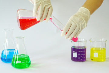 Group of Laboratory Glass Erlenmeyer conical flask, Beaker and Test Tube filled with chemical...