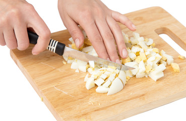 cook eggs on cutting board on a white background