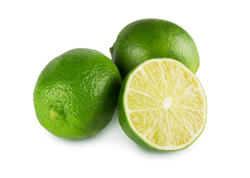 Fresh green limes core closeup isolated on white background