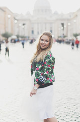 Happy young hipster woman in Rome