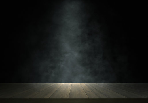 Spotlight and smoke on wooden stage
