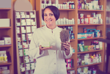 seller holding dried herbs