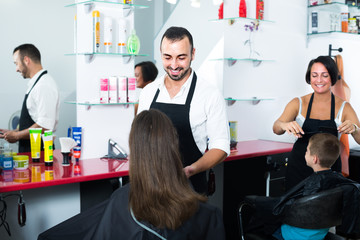man hairdresser talking to woman