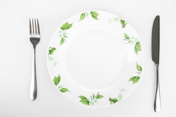  plate with a picture of flowers, knife and fork