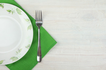 Plate and fork on a green napkin