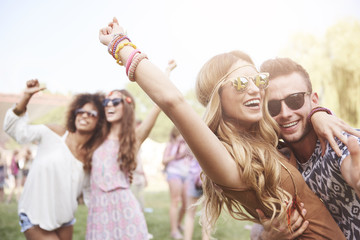 Young and cheerful couple in music festival