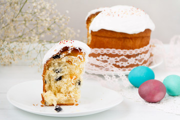Easter cake and painted eggs on a table. Traditional orthodox christian easter food. Side view, selective focus