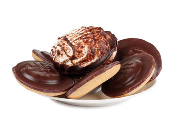 Sweet cookie and plate on white background