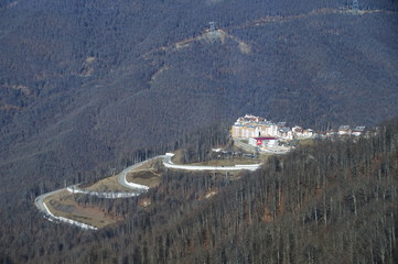 Alpine highway, mountain Olympic village. View from the mountain 1600 meters above sea level. Krasnaya Polyana, Sochi, Russia