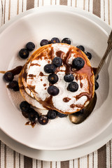 scottish pancake with powdered sugar and caramel sauce