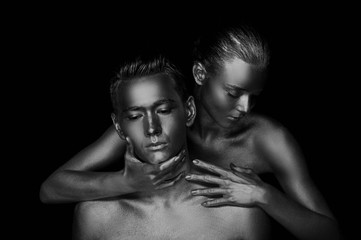 A girl and a boy, covered in gold paint. With my eyes closed. She bent down to him. Look in different directions. The fragmentation of interests, Black and white