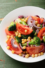 Tomatoes salad in white bowl