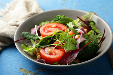 vegetables salad with greens in bowl