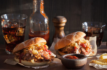 homemade pulled pork burger with caramelized onion and bbq sauce