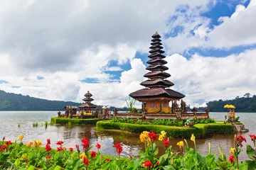 Fotobehang Temple Pura Ulun Danu Beratan. Traditional Balinese temple on lake. Place of festivals, famous travel attraction, day tour destination in Bali island, Indonesia. Indonesian people culture background. © Tropical studio