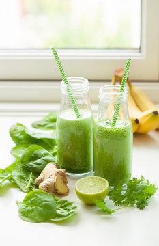 healthy green spinach smoothie with cilantro lime banana ginger
