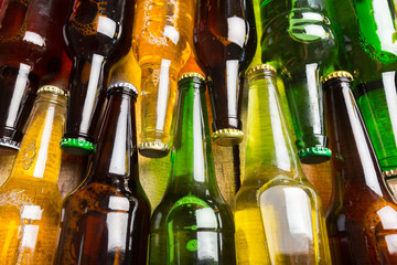 Beer bottles on a wooden table .