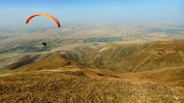 Paraplane, paraglider in the air aerial shot HD slow motion 50FPS