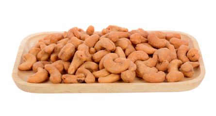 salted cashew nut in wood plate  isolated on white background