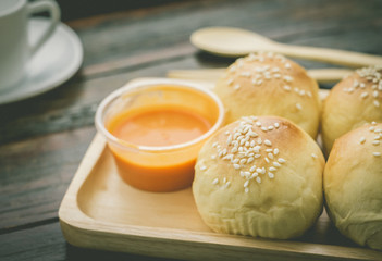 Fresh bread in wood plate. Food background.