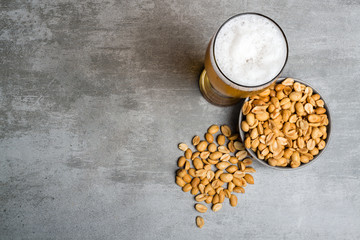Glass of beer and peanuts