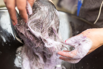 Naklejka premium Washing of female hair