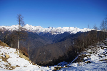 Snow-covered mountains at the village Krasnaya Polyana in autumn, Sochi, Russia