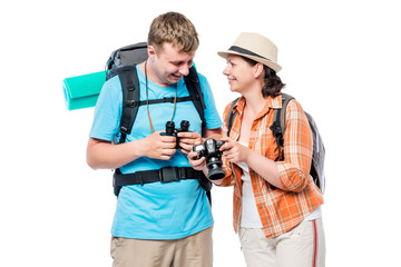 Active travelers with backpacks, girl with camera on white background