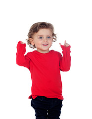 Adorable baby with red shirt pointing with his finger