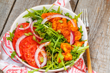 Salad with arugula and chicken. Healthy green food concept.