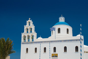 Architecture of island of Santorini, the most romantic island in the world, Greece.  Travel to Greece. Beautiful white exterior Santorini. White church with bell tower
