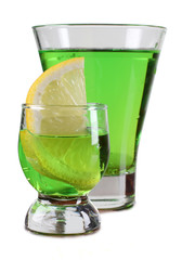 Glass cup with a cocktail and lemon on white background