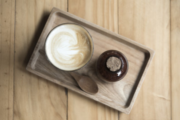coffee latte art on wooden table