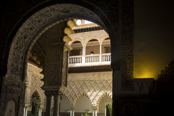 Interior of the Alcazar of Seville framed by doorway