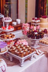 stylish luxury decorated orange candy bar for the celebration of a wedding of happy couple, cathering in the restaurant