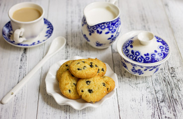Porcelain tea set with coffee and cookies