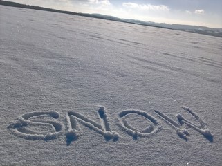 Snow Writing On the Field