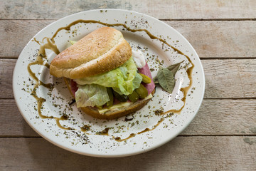 club sandwhich with cheese, salami, pickles, lettuce