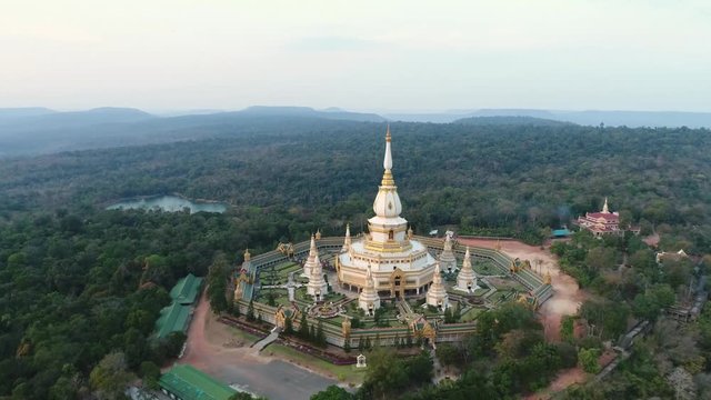 Aerial view of Thai tample "Wat Phra Mahathat Chedi Chaimongkol" 
Landmark at Roi-et, North-East of Thailand. (Drone camera movement)