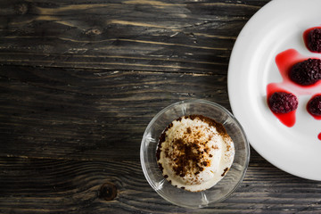 Ice cream with coffee on a wooden table. Delicious dessert.