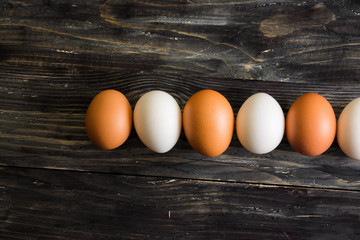 Chicken eggs on a wooden table. Natural product.