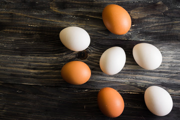 Chicken eggs on a wooden table. Natural product.