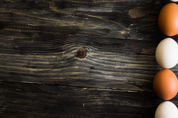 Chicken eggs on a wooden table. Natural product.