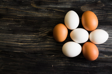 Chicken eggs on a wooden table. Natural product.