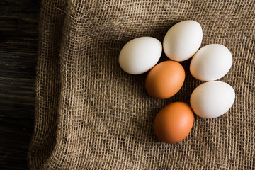 Chicken eggs on a wooden table. Natural product.