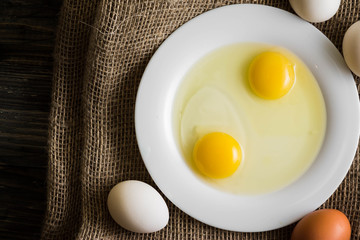 Chicken eggs on a wooden table. Natural product.